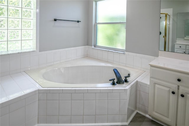 bathroom featuring vanity and plus walk in shower