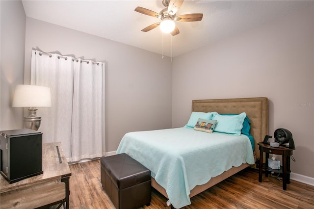 bedroom featuring ceiling fan and wood-type flooring