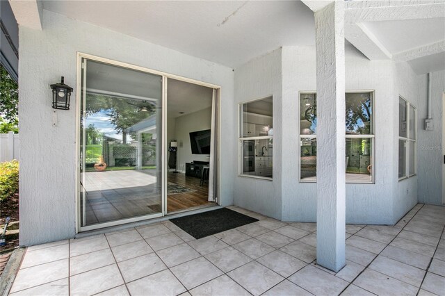 property entrance featuring a patio