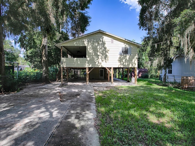 rear view of property with a lawn