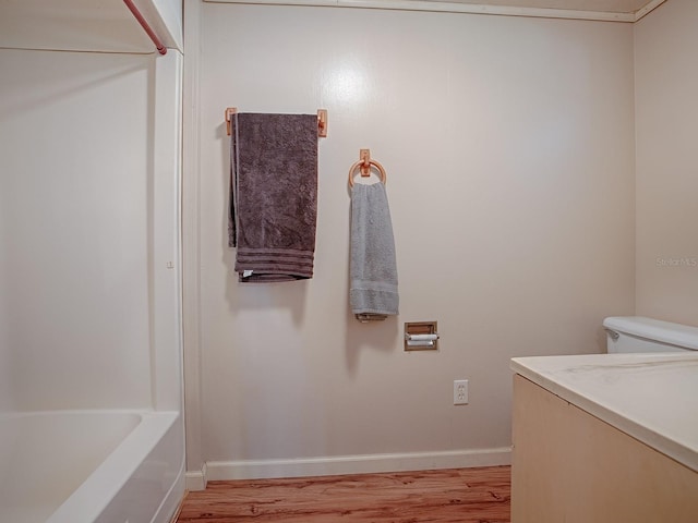 full bathroom with vanity, toilet, shower / bathing tub combination, and wood-type flooring