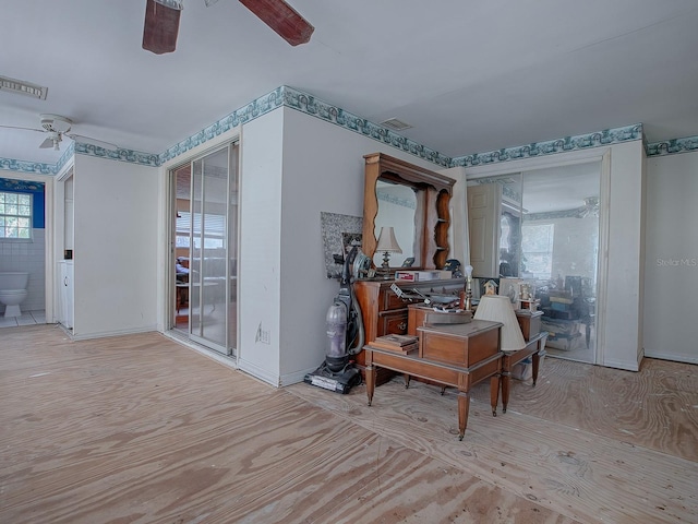 interior space featuring ceiling fan