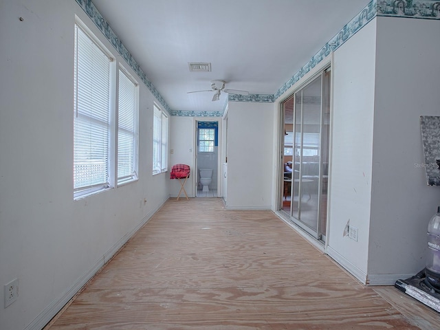 hall with light hardwood / wood-style floors