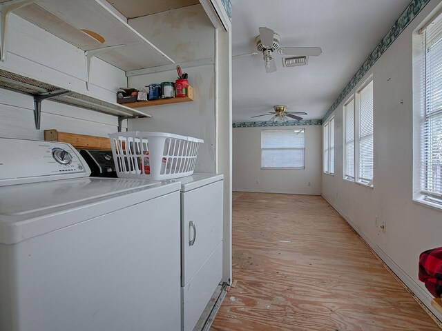 washroom with light hardwood / wood-style flooring, separate washer and dryer, and ceiling fan