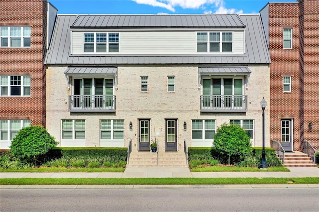 multi unit property featuring a balcony