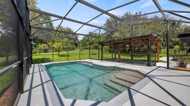 view of pool featuring a yard, a patio area, and a lanai