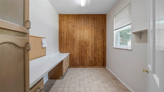 unfurnished office featuring light tile patterned floors