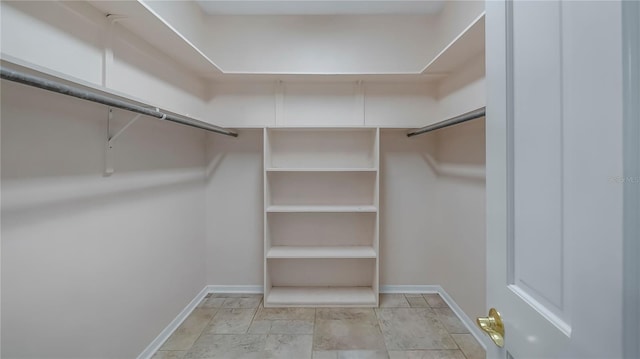 walk in closet featuring light tile patterned floors