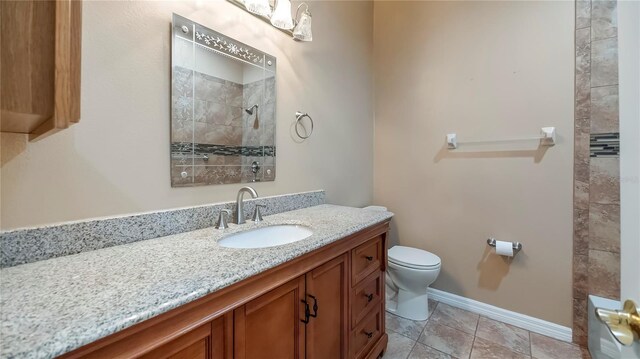 bathroom with tile patterned floors, toilet, and vanity