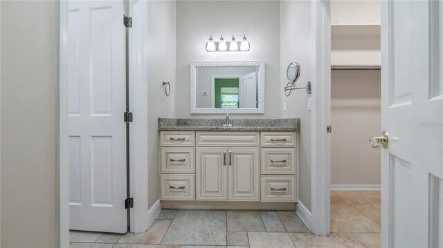 bathroom featuring vanity and tile patterned flooring