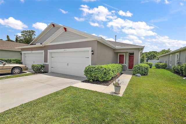 view of front of home featuring a garage and a front yard