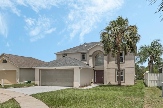 view of front of property featuring a garage and a front yard