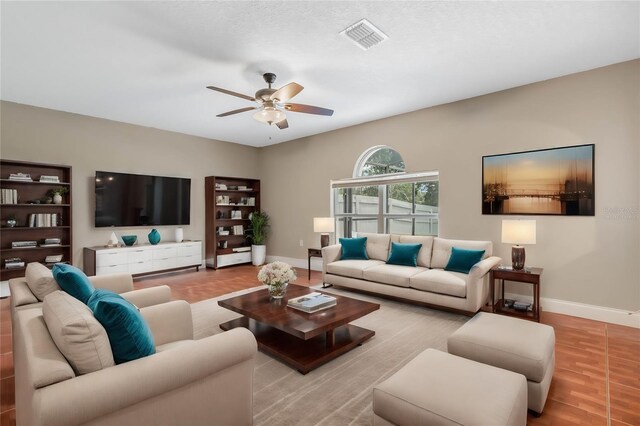 living room with light hardwood / wood-style flooring and ceiling fan