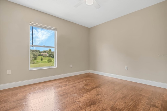 empty room with wood-type flooring and ceiling fan