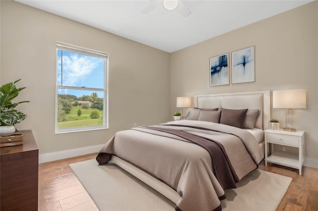 bedroom featuring light hardwood / wood-style flooring and ceiling fan