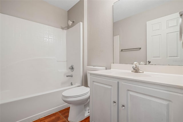 full bathroom featuring wood-type flooring, toilet, vanity, and shower / bathing tub combination