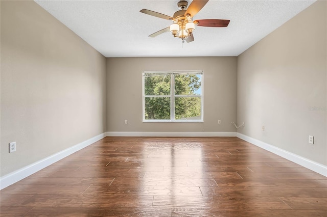 empty room featuring a textured ceiling, ceiling fan, and hardwood / wood-style floors