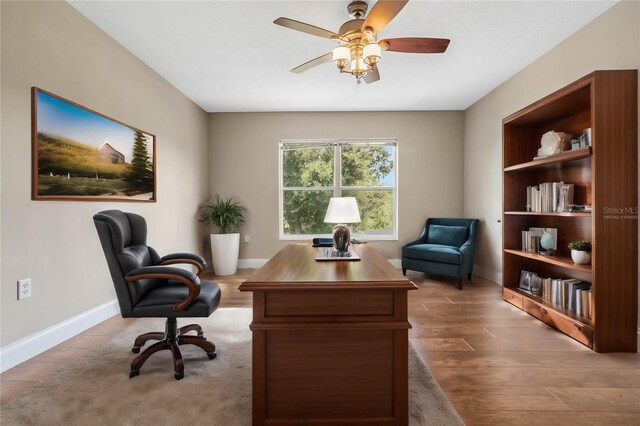 office featuring hardwood / wood-style flooring and ceiling fan