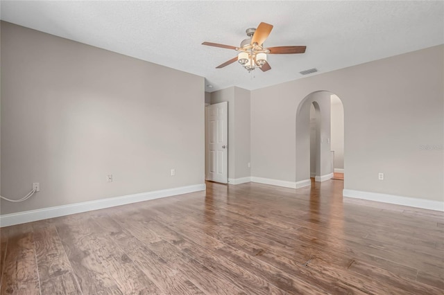 unfurnished room with hardwood / wood-style flooring, a textured ceiling, and ceiling fan