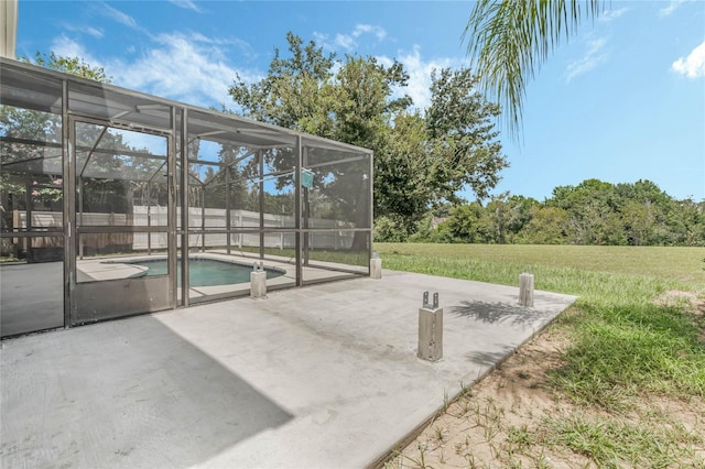 view of patio featuring a fenced in pool and glass enclosure