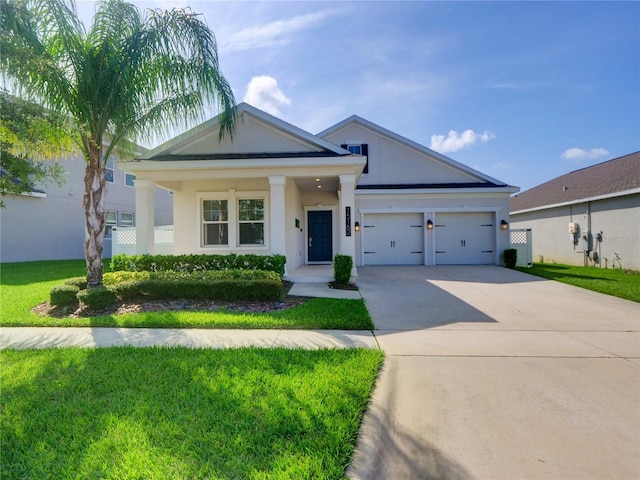 view of front facade with a garage and a front yard