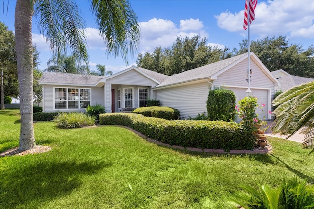 single story home featuring a front yard and a garage