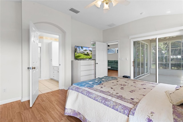 bedroom featuring ceiling fan, light wood-type flooring, access to outside, and lofted ceiling