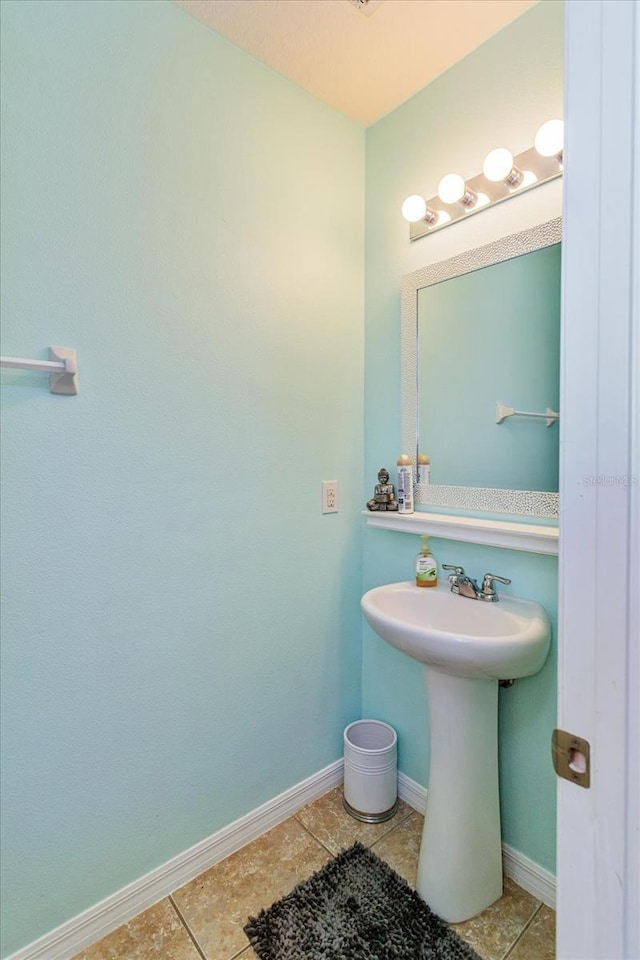 bathroom featuring tile patterned flooring and sink