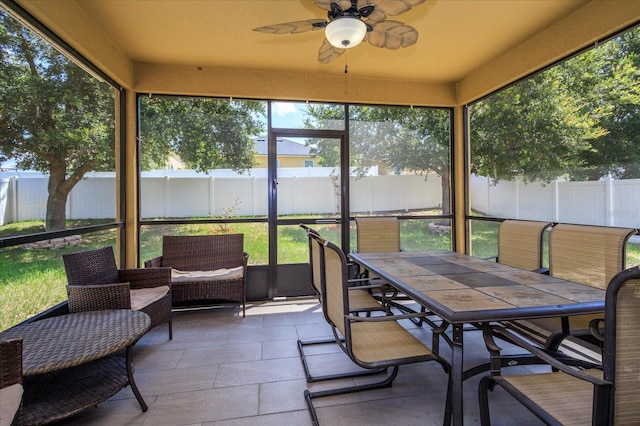 sunroom / solarium with ceiling fan