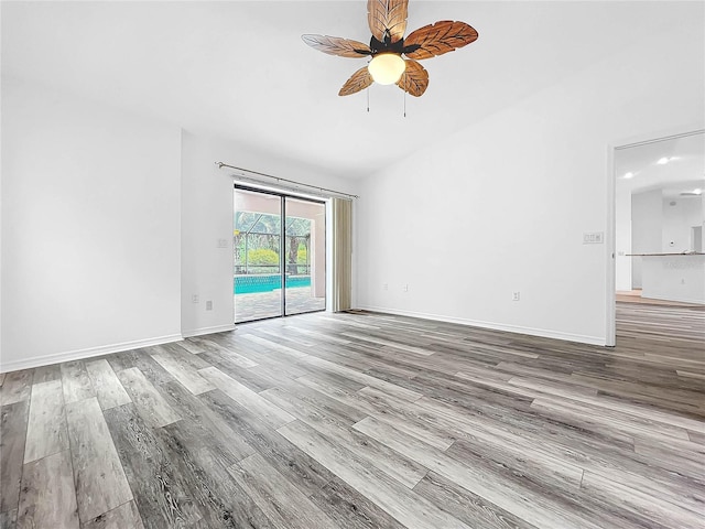 empty room with hardwood / wood-style flooring and ceiling fan