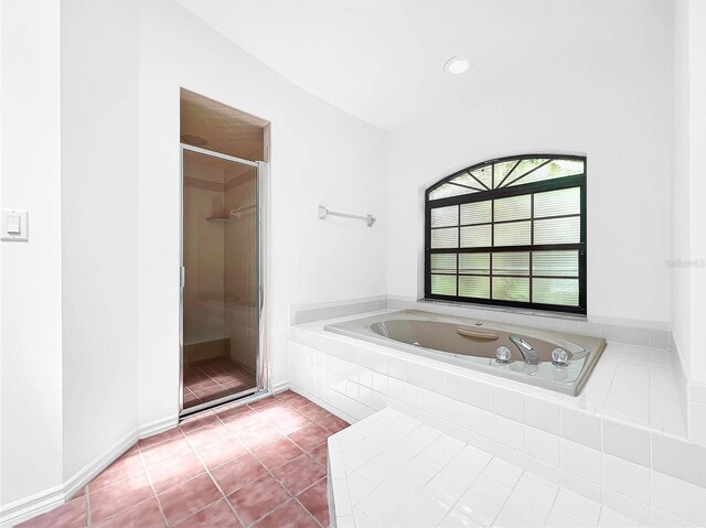 bathroom featuring shower with separate bathtub and tile patterned floors