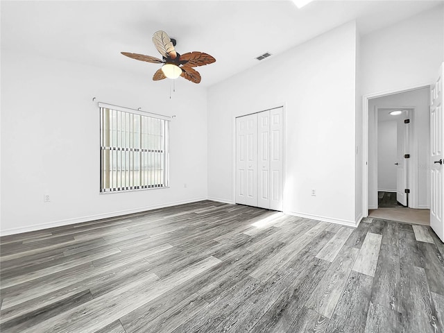 interior space with wood-type flooring and ceiling fan