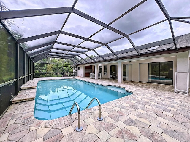 view of pool featuring a lanai and a patio area