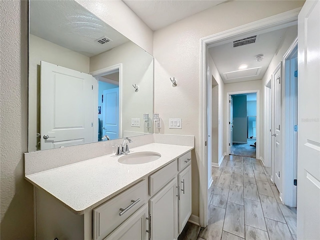 bathroom featuring vanity and hardwood / wood-style flooring