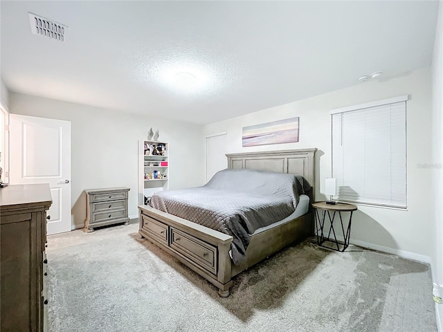 bedroom with light colored carpet