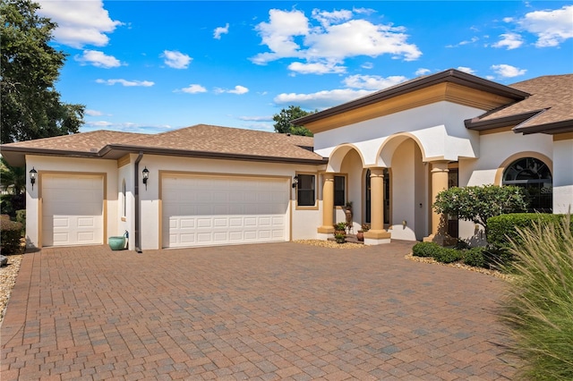 view of front of home with a garage