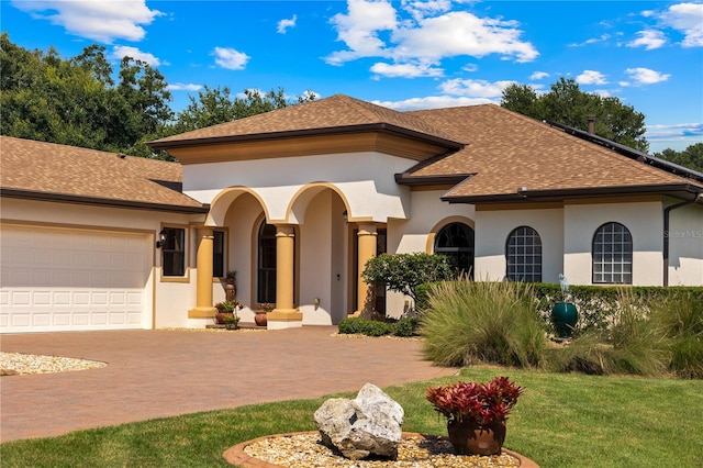 mediterranean / spanish house featuring a garage