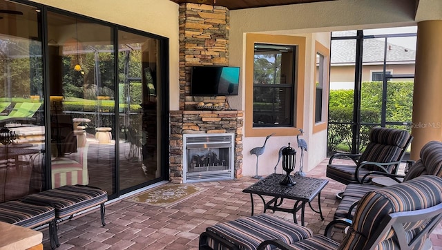 interior space with an outdoor stone fireplace