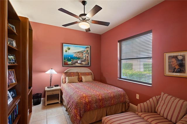 bedroom featuring light tile patterned floors and ceiling fan