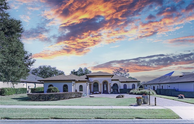 view of front of house with a lawn