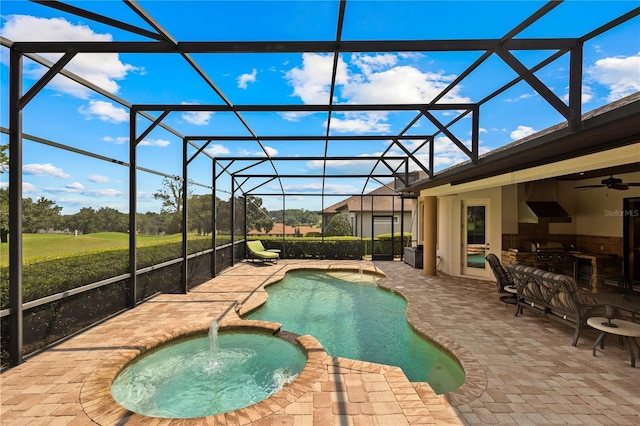 view of swimming pool featuring an in ground hot tub, a patio, grilling area, and a lanai