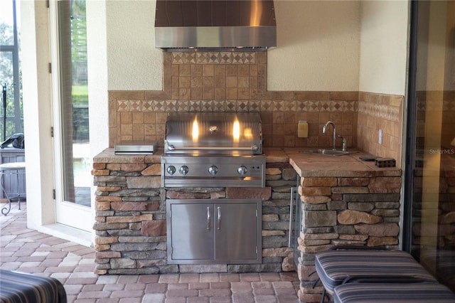 view of patio / terrace with area for grilling, exterior kitchen, and sink