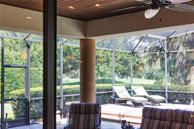 interior space with a healthy amount of sunlight, a pool, and wood ceiling