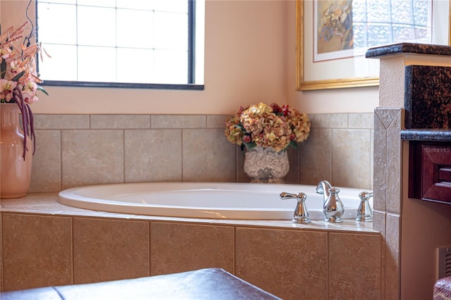 bathroom with tiled tub