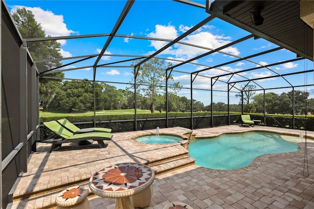 view of pool featuring a lanai, a patio area, and an in ground hot tub