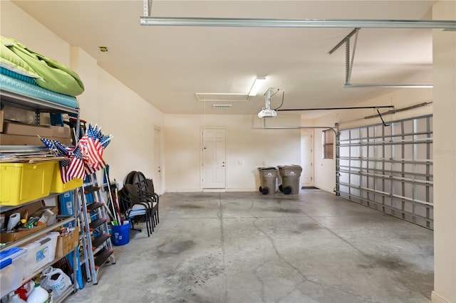 garage featuring a garage door opener