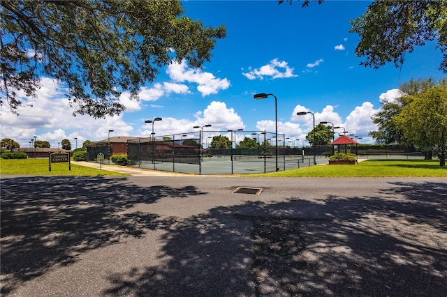 exterior space with tennis court