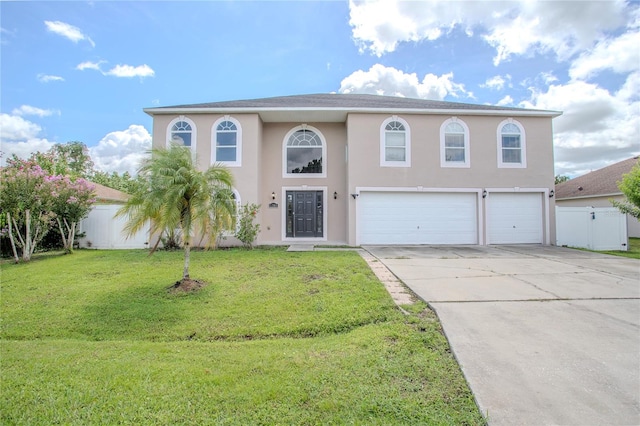 view of front of home featuring stucco siding, concrete driveway, an attached garage, fence, and a front lawn