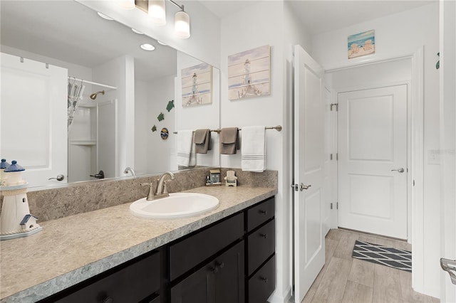 bathroom featuring vanity and hardwood / wood-style floors