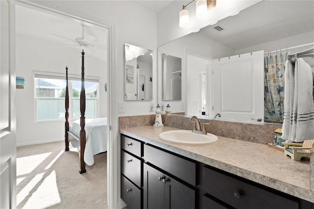 bathroom featuring ceiling fan and vanity